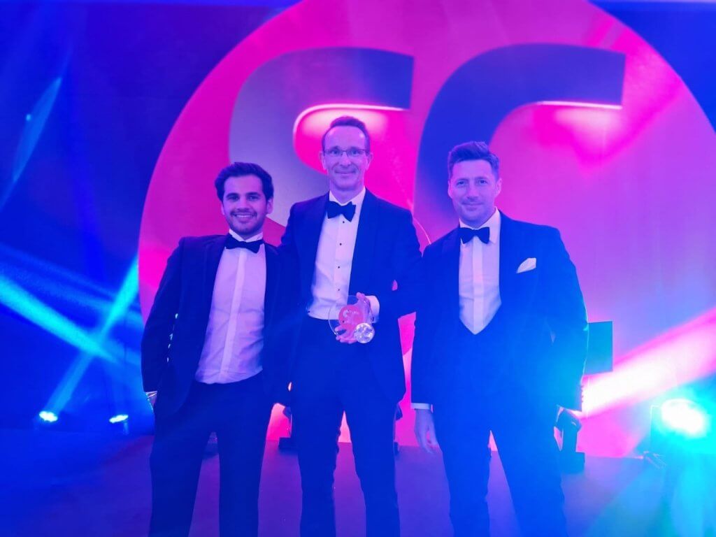 Myself, Jono, and Nabdeep from our Customer Success team, receiving an award and doing our best Bond impressions.
